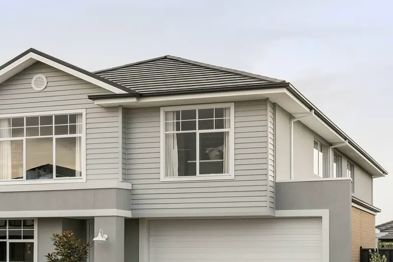 Repainted grey two-storey home exterior