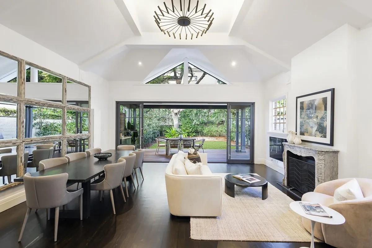 New build living and dining space with cathedral ceilings, painted throughout